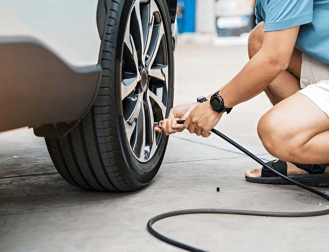 Technician delivering roadside assistance