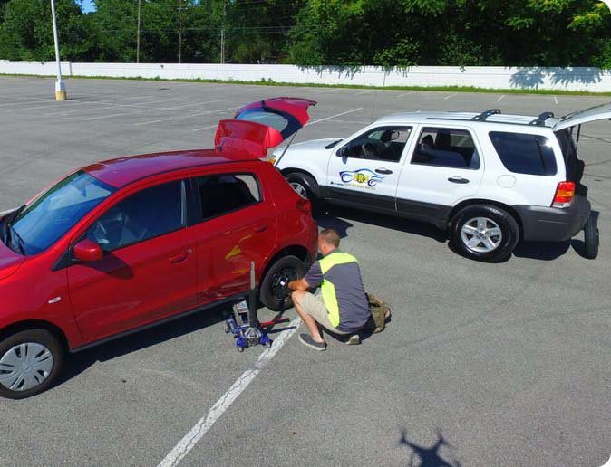 Technician performing a mobile tire change roadside